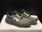 Tênis On Running Cloudmonster 3 marrom/amarelo