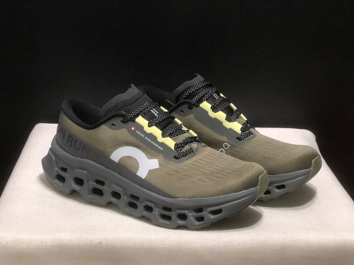 Tênis On Running Cloudmonster 3 marrom/amarelo