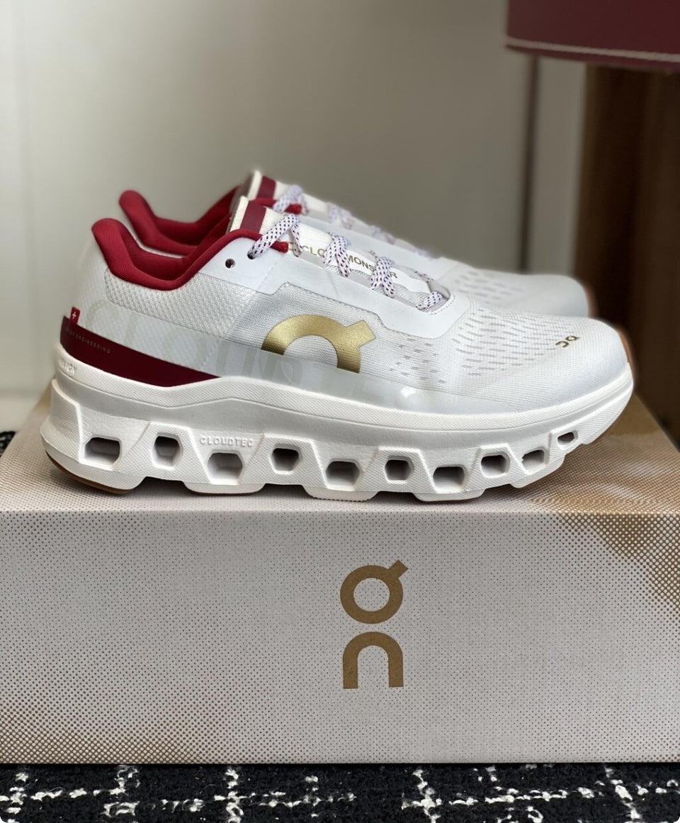 Tênis On Running Cloudmonster Branco/Dourado